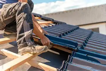 A worker installing roof