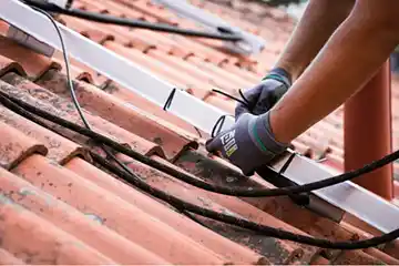 A guy maintaining roof