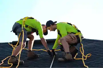 Two worker replacing the roof